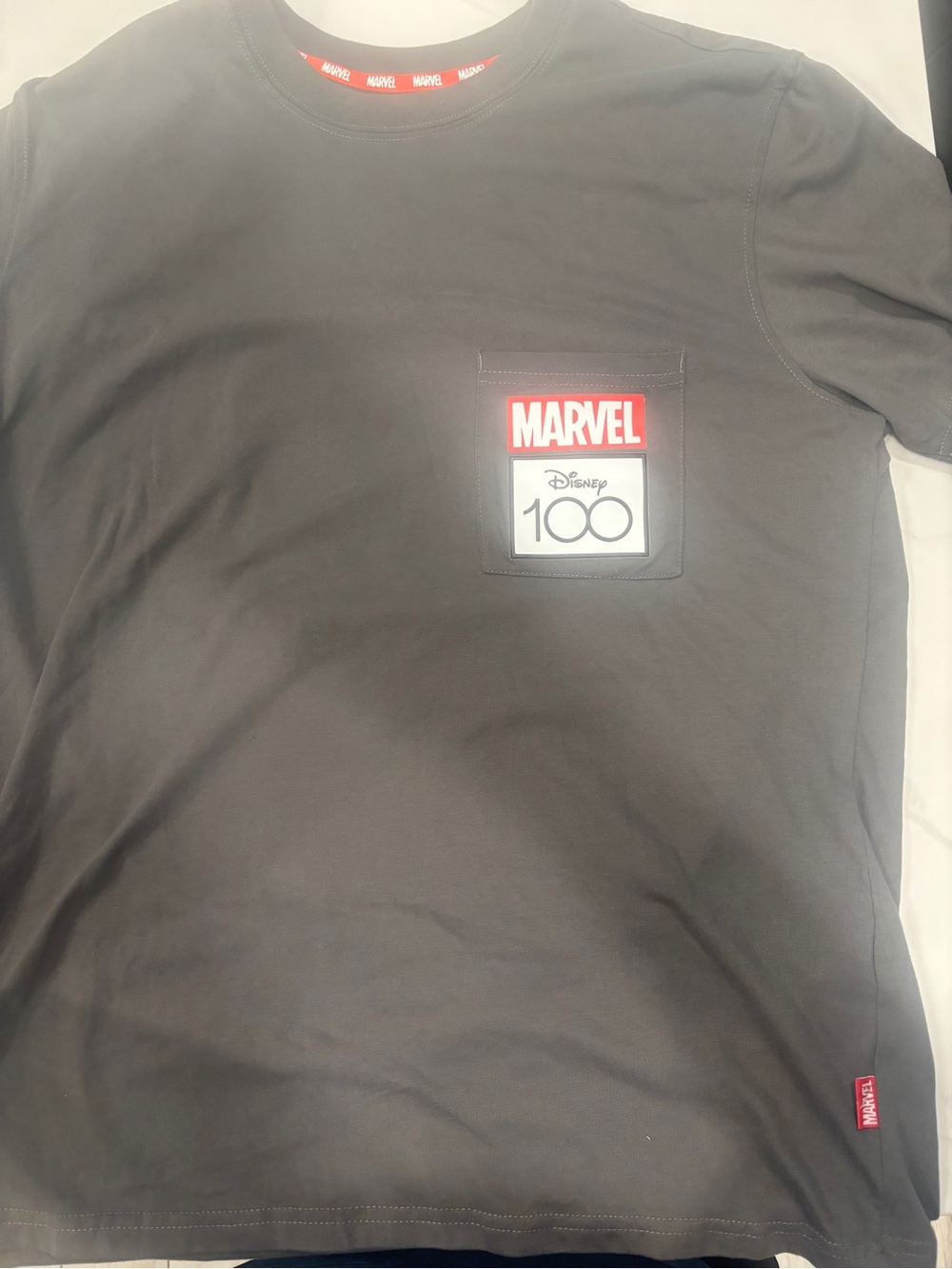 Marvel Black Short Sleeve Pocket Tee with Red Logo